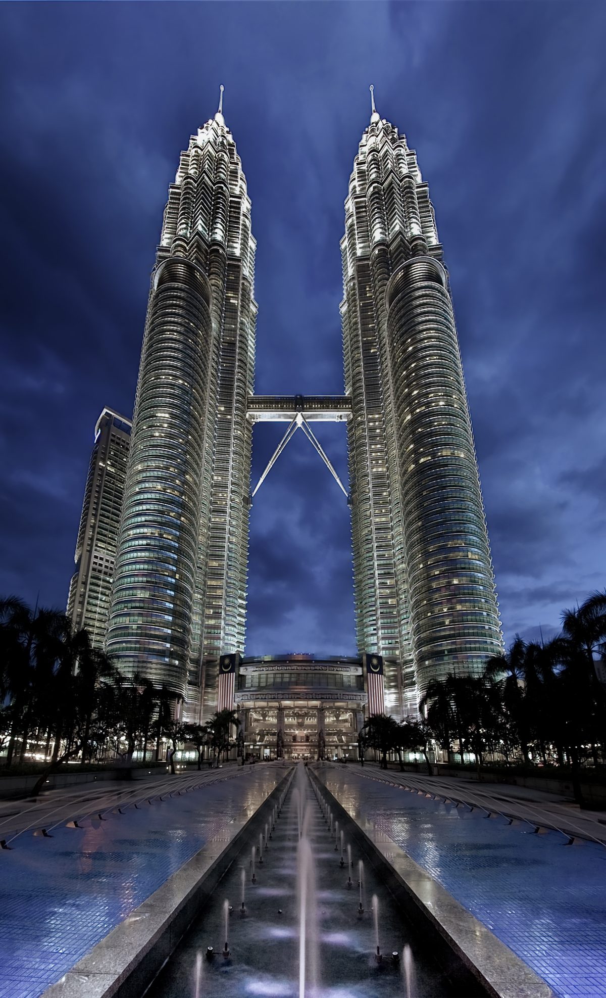 Panoramic view of the completed Petronas Twin Towers rising above KL