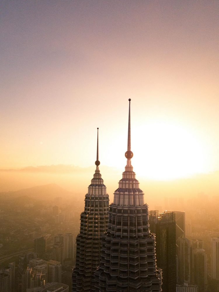 Petronas Towers bathed in warm sunset light