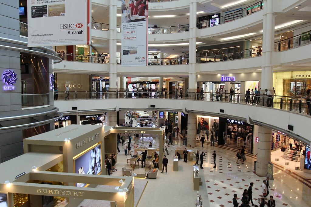 Interior of Suria KLCC mall showing multiple levels and shoppers