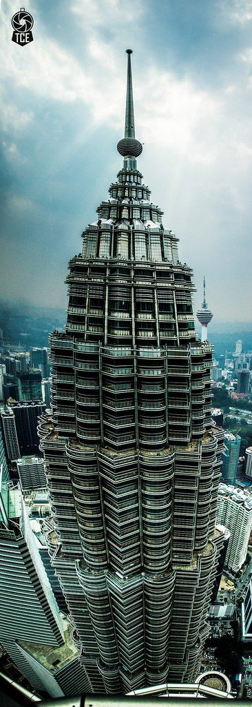 The completed Petronas Twin Towers lit up at dusk