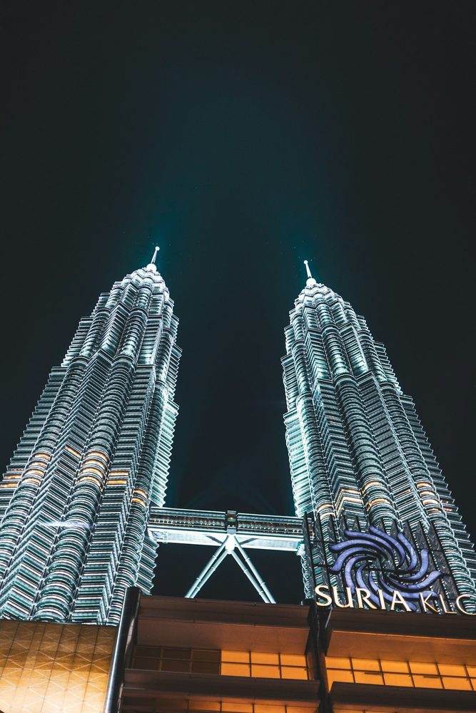 Petronas Towers glowing against the dark sky