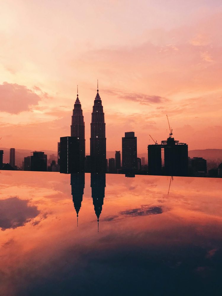 Petronas Twin Towers silhouetted at sunset